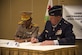 Maj. Gen. Zakaria Cheik Ibrahim, the Djiboutian Armed Forces (FAD) chief of defense, and Maj. Gen. Edward Tonini, the Kentucky National Guard (KNG) adjutant general, sign a State Partnership Program agreement at the Kempinski Hotel, Djibouti, June 2, 2015. The agreement means a long-term cooperative agreement between the KNG and FAD that will foster mutually beneficial exchanges between the two at all levels of the military as well as the civilian world. (U.S. Air Force photo/Staff Sgt. Nathan Maysonet)