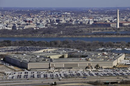 The Pentagon with the Washington Monument and National Mall in the background. Defense Department officials issued information on a potential data breach at the Office of Personnel Management affecting current and former federal employees.