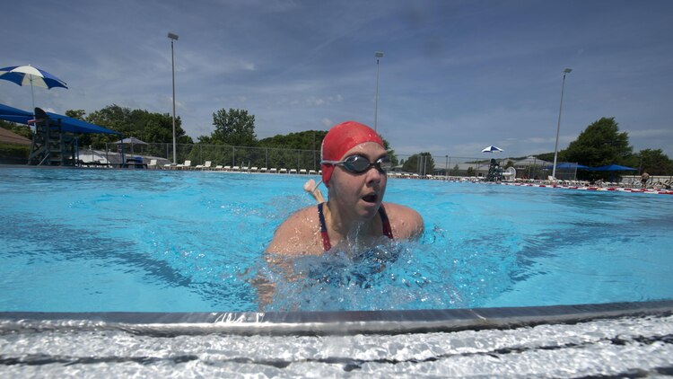 Michelle Mummers, a retired Marine major and wounded warrior, swims at Marine Corps Base Quantico, Virginia May 28, 2015 in preparation for the 2015 Department of Defense Warrior Games. This will be Mummer’s second time competing in both the cycling and swimming portion of the games.