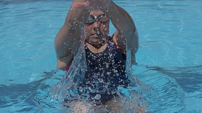 Michelle Mummers, a retired Marine major and wounded warrior, swims at Marine Corps Base Quantico, Virginia May 28, 2015 in preparation for the 2015 Department of Defense Warrior Games. This will be Mummer's second time competing in both the cycling and swimming portion of the games.