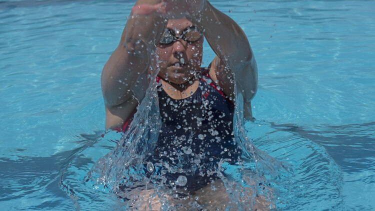 Michelle Mummers, a retired Marine major and wounded warrior, swims at Marine Corps Base Quantico, Virginia May 28, 2015 in preparation for the 2015 Department of Defense Warrior Games. This will be Mummer's second time competing in both the cycling and swimming portion of the games.
