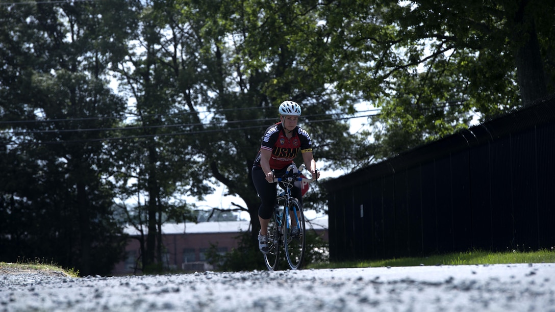 Michelle Mummers, a retired Marine major and wounded warrior, cycles at Marine Corps Base Quantico, Virginia May 28, 2015 in preparation for the 2015 Department of Defense Warrior Games. This will be Mummer’s second time competing in both the cycling and swimming portion of the games.