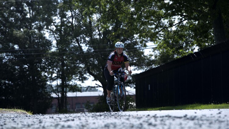 Michelle Mummers, a retired Marine major and wounded warrior, cycles at Marine Corps Base Quantico, Virginia May 28, 2015 in preparation for the 2015 Department of Defense Warrior Games. This will be Mummer’s second time competing in both the cycling and swimming portion of the games.