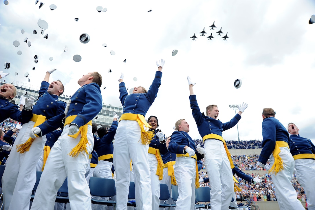Members of the U.S. Air Force Academy Class of 2015 toss their hats in celebration as the Thunderbirds roar over Falcon Stadium in Colorado Springs, Colo., May 28, 2015. Over 800 cadets graduated and became second lieutenants. Secretary of the Air Force Deborah Lee James gave the graduation address. (Air Force photo/Jason Gutierrez) 