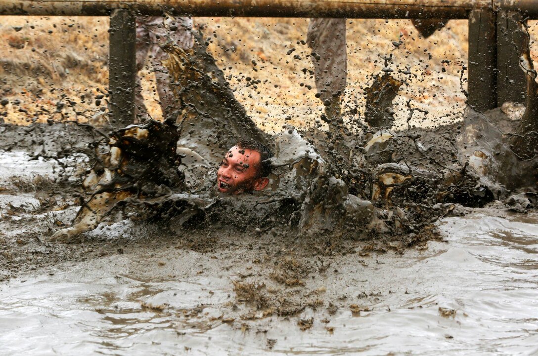 Camp Pendleton is implementing a new washing system during the Mud Run, June 6, 7, 13 and 14, to meet water conservation objectives for Marine Corps Installations - West. 
During the Mud Run, 80 percent of water is used at the finish line to wash participants down. Marine Corps Community Services is adopting a more efficient washing system that uses a mixture of soap and warm water to alleviate water consumption concerns.  (Photo by Cpl. Sarah Wolff/Released)

