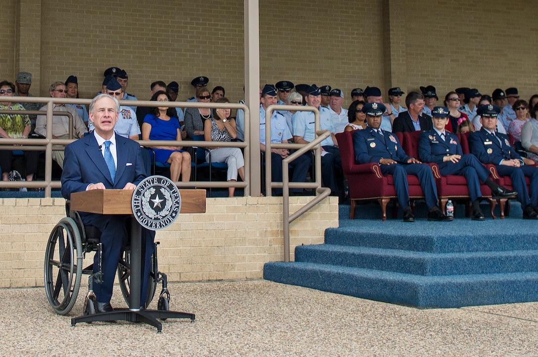 Texas Gov. Greg Abbott  delivers a speech to the graduating class of Airmen at the Basic Military Training parade June 5, 2015 at Joint Base San Antonio-Lackland, Texas. Gov. Abbott was a distinguished visitor at the BMT parade, and addressed the graduating Airmen. (U.S. Air Force photo by Benjamin Faske) 