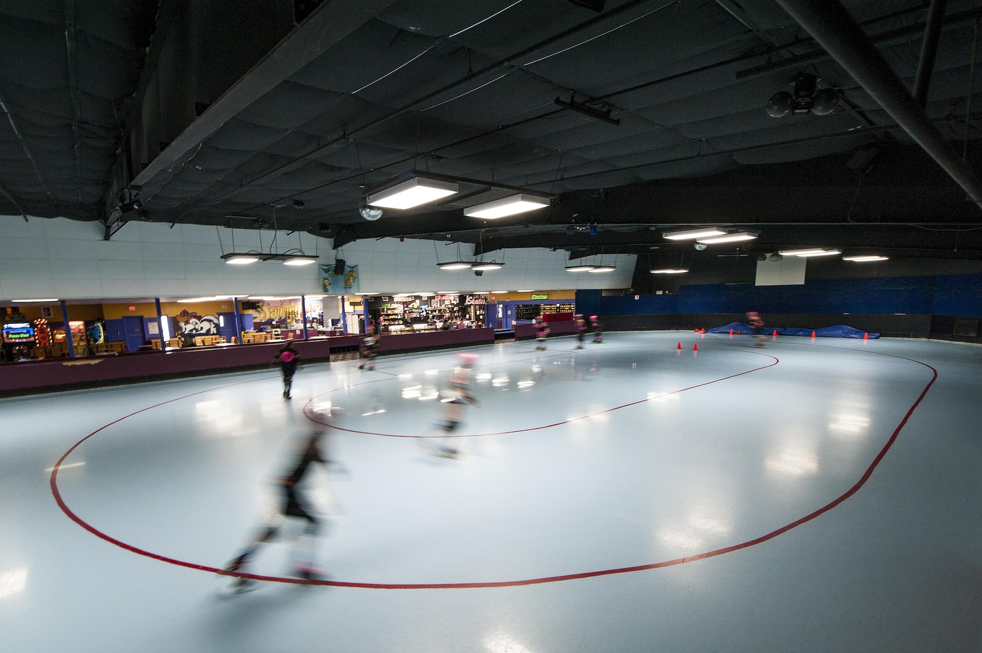 Members of the San Angelo Roller Girls roller derby skate warm up laps around the track at The Rink in San Angelo, Texas, May 27, 2015. The team’s practice consist of warm ups, stretches, drills and a practice bout. (U.S. Air Force photo by Staff Sgt. Michael Smith/Released)