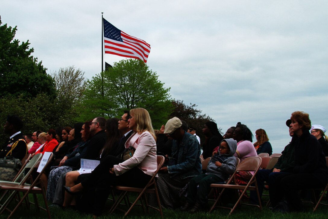Families and friends of more than 20 U.S. Marine Corps applicants spectate a mass swear in a ceremony at the Grosse Pointe War Memorial in Grosse Pointe Farms, Michigan, May 19, 2015. Each applicant who attended the event raised their right hand and took the oath of enlistment signifying their commitment to their country. (U.S. Marine Corps photo by Cpl. J. R. Heins/Released)