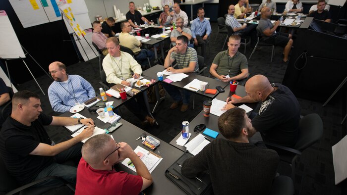 Marines and civilians attend a meeting hosted at ManTech Spaces in Stafford Va. June 2, 2015 to discuss Intelligence problems the Marine Corps faces. This is the second time this meeting was hosted.