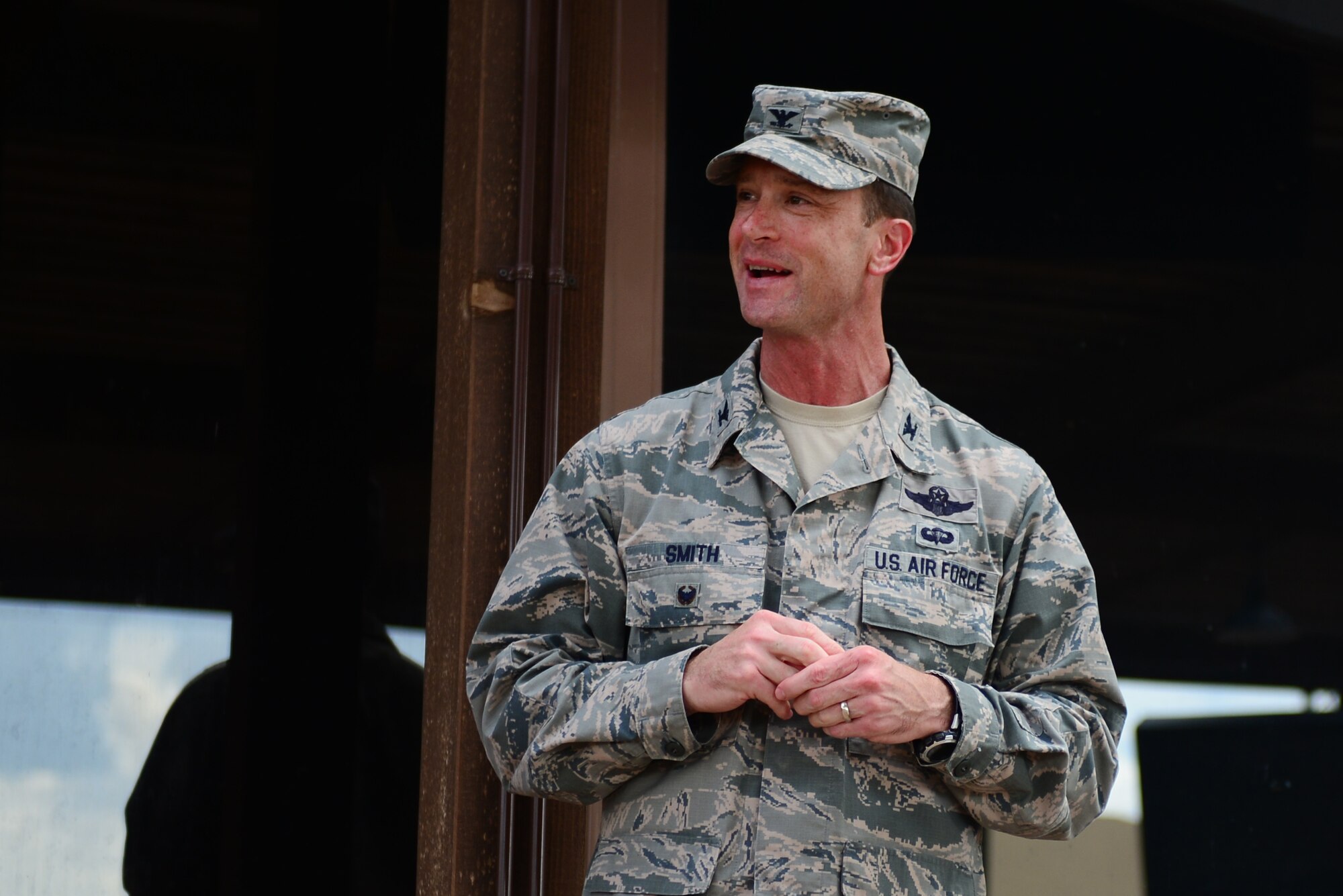 U.S. Air Force Col. Matt Smith, 27th Special Operations Wing vice commander, delivers remarks at the ribbon cutting marking the reopening of the Drop Zone June 4, 2015 at Cannon Air Force Base, N.M. Smith spoke with pride about the contributions made by agencies across the base in order to make the 27th Special Operations Force Support Squadron’s vision for the facility a reality. (U.S. Air Force Photo/Airman 1st Class Shelby Kay-Fantozzi)
