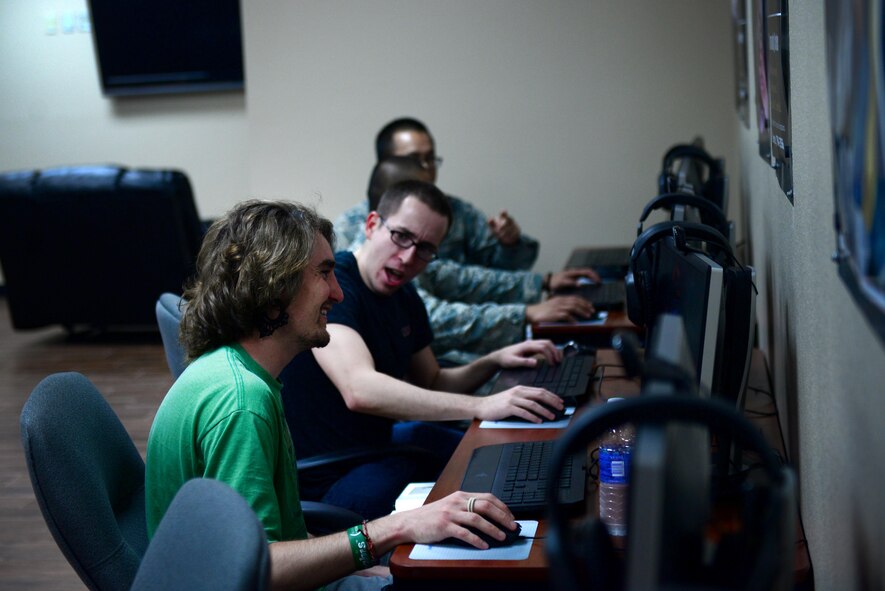 Cannon gamers join forces to battle their online opponents June 4, 2015 at Cannon Air Force Base N.M. The players met in the renovated Drop Zone’s new gaming room, one of several responses to Air Commandos’ interests directly met by the facility’s remodeling. (U.S. Air Force Photo/Airman 1st Class Shelby Kay-Fantozzi)