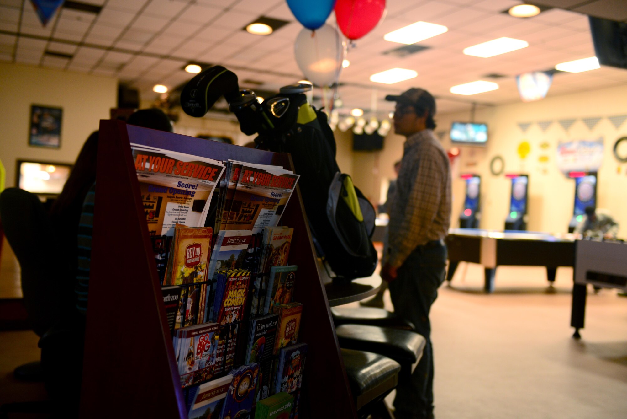 The Drop Zone’s new Information, Tickets, and Tours desk displays local attractions and on-base equipment rentals June 4, 2015 at Cannon Air Force Base, N.M. Bringing the Outdoor Recreation mission under the Drop Zone’s roof was a piece of the Community Commons concept of including several base facilities in one family-friendly space. (U.S. Air Force Photo/Airman 1st Class Shelby Kay-Fantozzi)