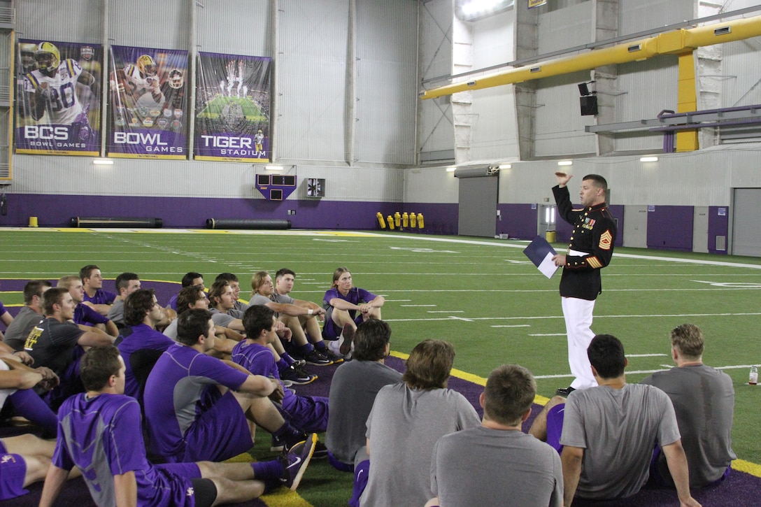 Master Sergeant Kevin Boggs, Recruiting Station Baton Rouge Officer Selection Assistant, gives a motivational speech to the players of the Louisiana State University baseball team, June 5. The team will be playing UL-Lafayette this weekend in the National Collegiate Athletic Association Super Regional at the Alex Box Stadium in Baton Rouge. The winner of the best-of-three Super Regional advances to the College World Series in Omaha, Nebraska, June 13-24.