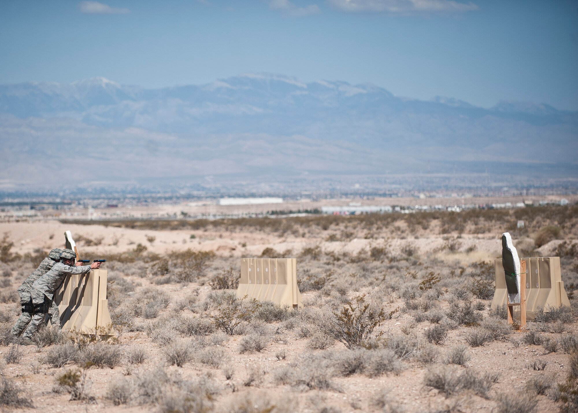 Participants in the Warrior Challenge complete the shoot, move and communicate portion of the contest at Nellis Air Force Base, Nev., May 29, 2015. The shoot, move and communicate course tested participants’ shooting ability and overall teamwork in a tactical environment. (U.S. Air Force photo by Staff Sgt. Siuta B. Ika)