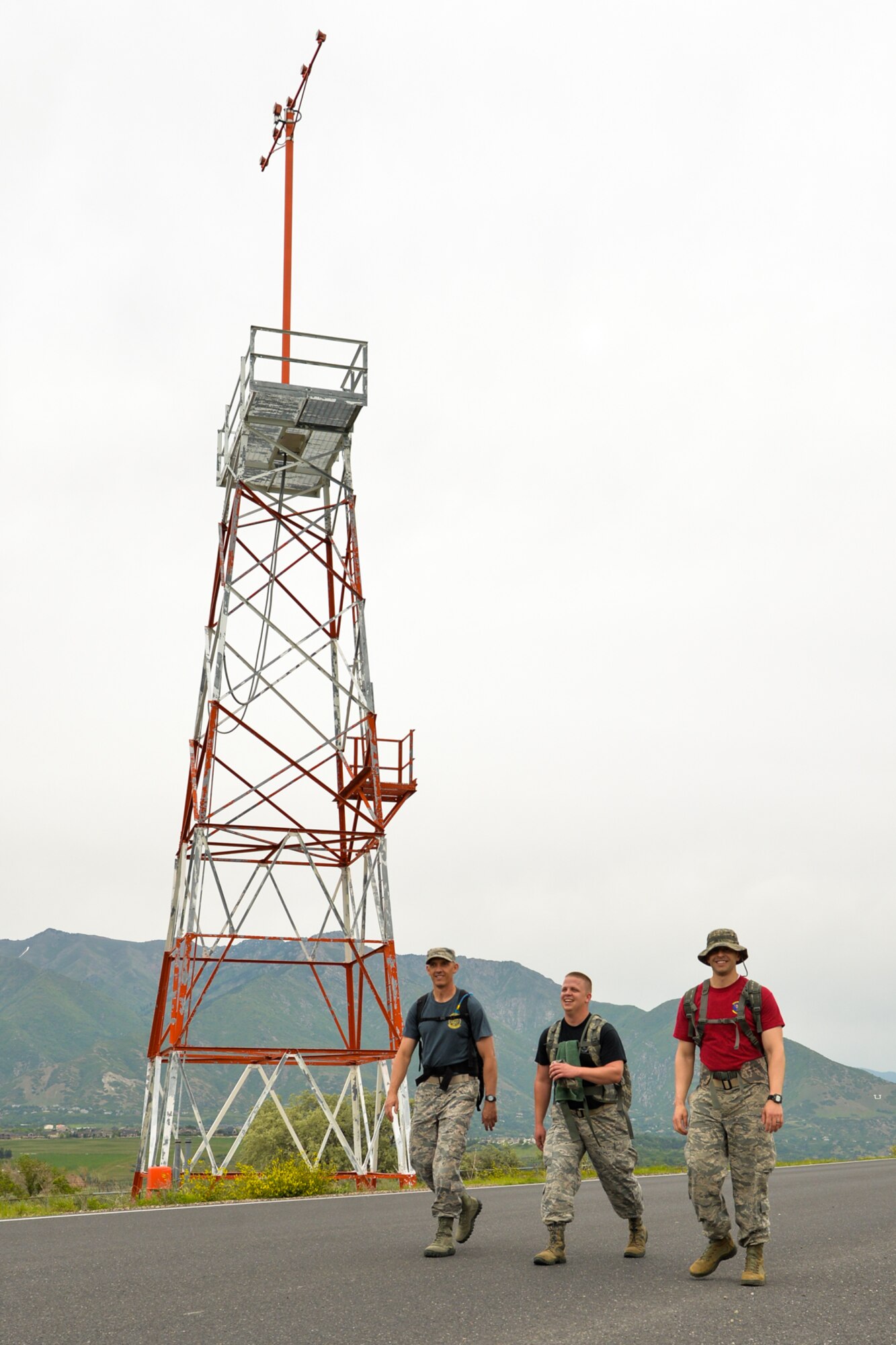 Tech. Sgt. Ryan Howard, 419th Security Forces Squadron; Chief Master Sgt. Matthew McElreath, 67th Aerial Port Squadron; and 1st Lt. Sterling Broadhead, 67th APS; participate in the 8th Annual Ruck March along the 13-mile perimeter road of Hill Air Force Base June 8. (U.S. Air Force photo/R. Nial Bradshaw)