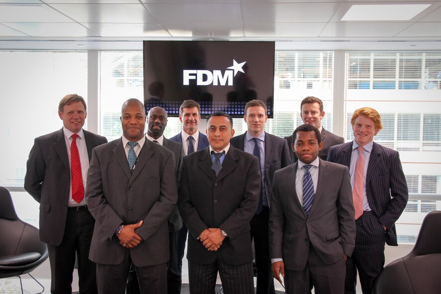 Front row center: Staff Sgt. Joe Castro, a 69th Aerial Port Squadron air transportation specialist, stands with his classmates for a group photo. Castro is currently attending the senior program management course offered by the FDM Group in London, England. (Courtesy photo)