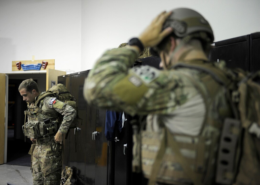 Senior Airman Aaron D’Angelo, left, 11th Civil Engineer Squadron Explosive Ordnance Disposal journeyman, and Staff Sgt. Luke Mefford, 11th CES EOD training and quality control technician, prepare for an exercise June 4, 2015, on Joint Base Andrews, Md. JBA EOD Airmen consistently perform training to stay ready for a wide variety of responsibilites. (U.S. Air Force photo by Senior Airman Preston Webb/Released)