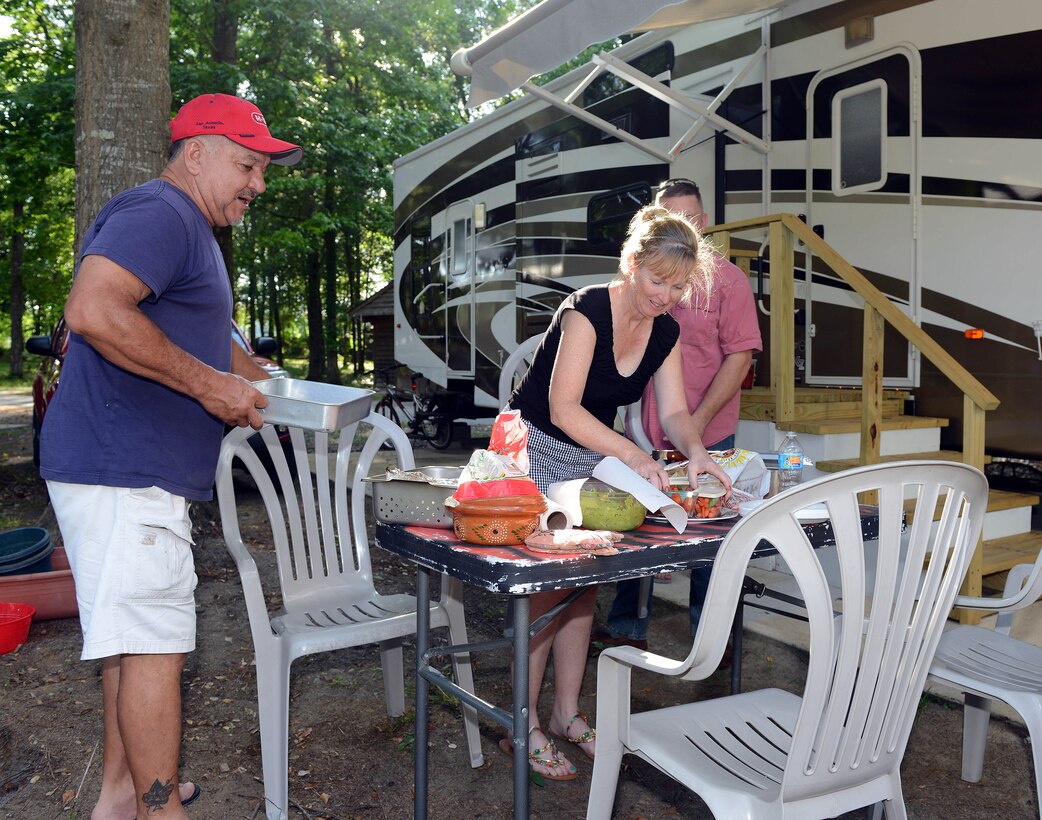 Retiree Juan Bermudez and his wife, Kelli, prepare for an evening cookout at Robins Family Campground, May 20, 2015. (U.S. Air Force photo by Tommie Horton)