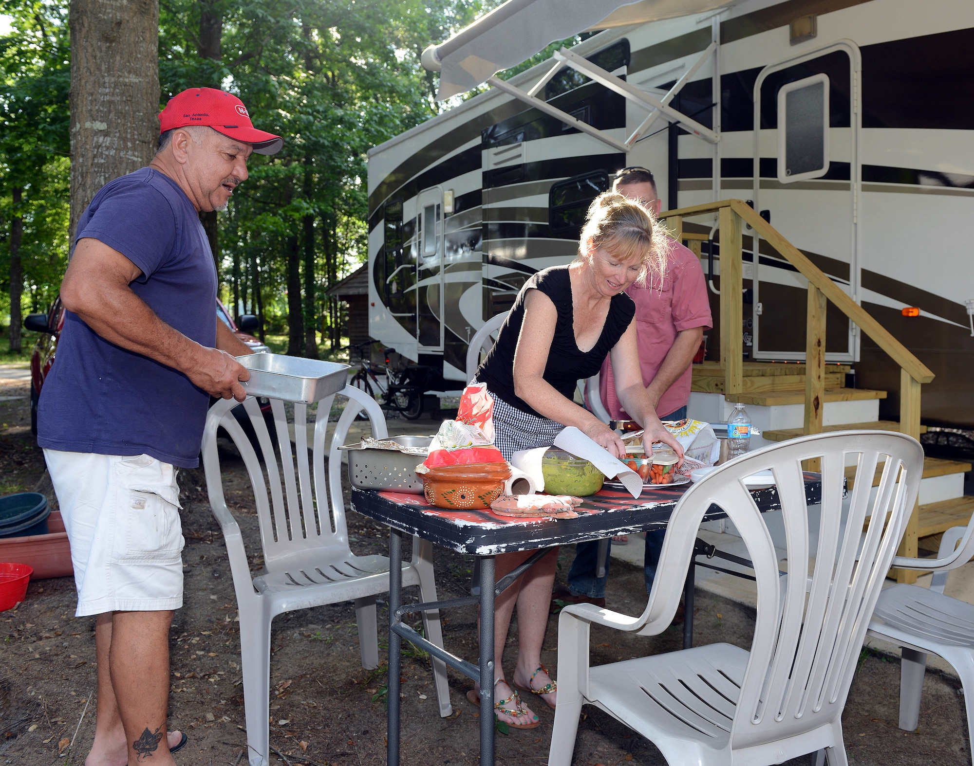 Retiree Juan Bermudez and his wife, Kelli, prepare for an evening cookout at Robins Family Campground, May 20, 2015. (U.S. Air Force photo by Tommie Horton)
