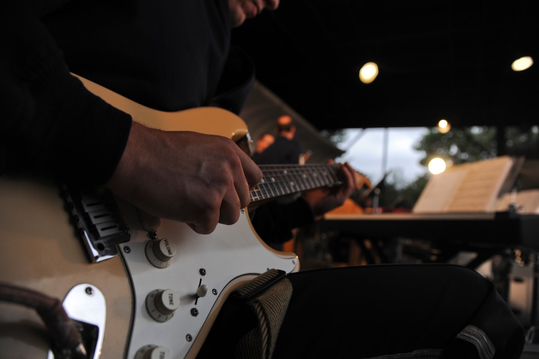 Master Sgt. Matthew Geist, U.S. Air Force Band premier bandsman, plays guitar at the Sylvan Theatre, District of Columbia, June 3, 2015. Members of the U.S. Air Force Band’s Concert Band and Singing Sergeants performed a concert at the Sylvan Theatre, near the Washington Monument. (U.S. Air Force photo/ Airman 1st Class J.D. Maidens)