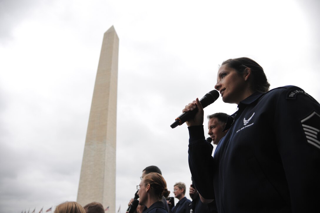 Master Sgt. Emily Wellington, U.S. Air Force Band vocalist, sings at the Washington Monument, June 3, 2015. The U.S. Air Force Band performed a concert at the Sylvan Theatre, District of Columbia. (U.S. Air Force photo/ Airman 1st Class J.D. Maidens)