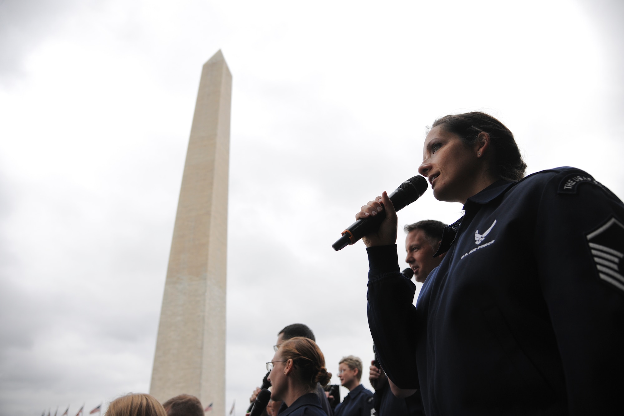 Master Sgt. Emily Wellington, U.S. Air Force Band vocalist, sings at the Washington Monument, June 3, 2015. The U.S. Air Force Band performed a concert at the Sylvan Theatre, District of Columbia. (U.S. Air Force photo/ Airman 1st Class J.D. Maidens)