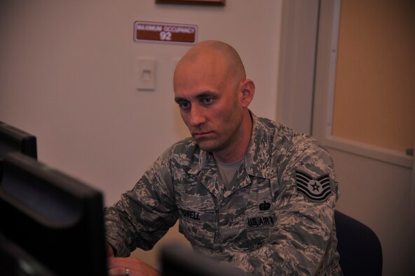 Tech. Sgt. Ian Powell, 336th Training Support Squadron network operations NCO in charge, works on a computer May 13, 2015, at Fairchild Air Force Base, Wash. Powell provides communication support for the U.S. Air Force Survival School. His leadership selected him as one of Fairchild’s Finest, a weekly recognition program that highlights top-performing Airmen. (U.S. Air Force photo/Airman 1st Class Taylor Bourgeous)