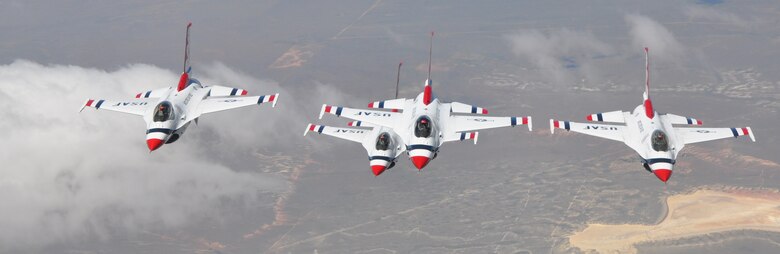 The U.S. Air Force Thunderbirds Air Demonstration Squadron fly their F-16 Fighting Falcons in formation near the refueling boom of a KC-135 Stratotanker from McConnell Air Force Base, Kan., June 4, 2015. The KC-135 provided cross-country air refueling support for the Thunderbirds. The KC-135 aircrew, all Air Force Reservists from the 931st Air Refueling Group, performed fourteen air refueling contacts during the mission. The squadron was on its way to the Heart of Texas Airshow in Waco, Texas, June 6-7. The squadron performs approximately 75 demonstrations each year and has never canceled a demonstration due to maintenance difficulty. More than 300 million people in all 50 states and 58 foreign countries have seen the red, white and blue jets in more than 4,000 aerial demonstrations. (U.S. Air Force photo by Tech. Sgt. Abigail Klein)