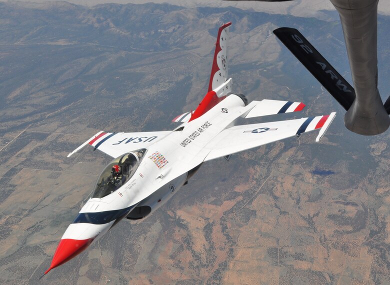 Capt. Alex Goldfein, the right wing pilot for the U.S. Air Force Thunderbirds Air Demonstration Squadron, flies away from the boom of a KC-135 Stratotanker assigned to McConnell Air Force Base, Kan., June 4, 2015. The KC-135 provided cross-country air refueling support for the Thunderbirds. The KC-135 aircrew, all Air Force Reservists from the 931st Air Refueling Group, performed fourteen air refueling contacts during the mission. (U.S. Air Force photo by Tech. Sgt. Abigail Klein)