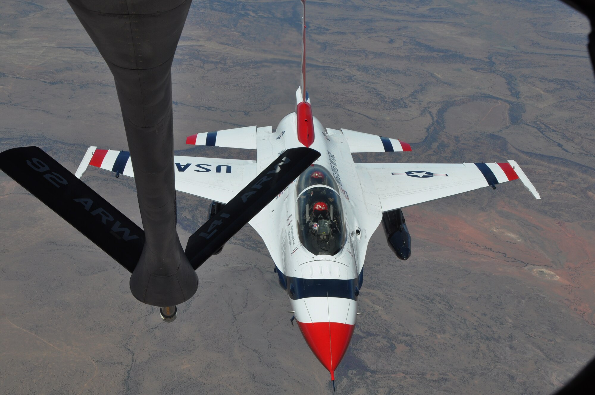 An F-16 Fighting Falcon aircraft piloted by Maj. Tyler Ellison, the operations officer for the U.S. Air Force Thunderbirds Air Demonstration Squadron, approaches the boom of a KC-135 Stratotanker assigned to McConnell Air Force Base, Kan., June 4, 2015. The KC-135 provided cross-country air refueling support for the Thunderbirds. The KC-135 aircrew, all Air Force Reservists from the 931st Air Refueling Group, performed fourteen air refueling contacts during the mission. (U.S. Air Force photo by Tech. Sgt. Abigail Klein)