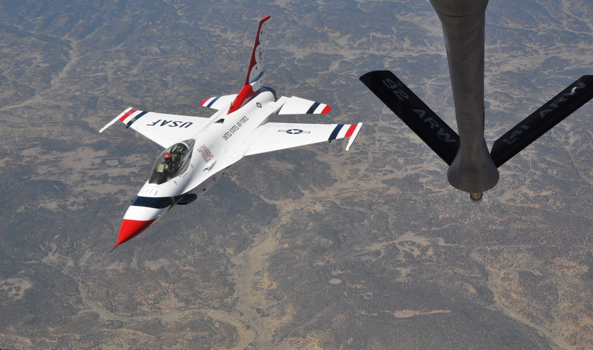 Maj. Jason Curtis, lead solo pilot for the U.S. Air Force Air Demonstration Squadron, rejoins his team after receiving an air refueling from KC-135 Stratotanker assigned to McConnell Air Force Base, Kan., June 4, 2015.  The KC-135 aircrew, all Air Force Reservists from the 931st Air Refueling Group, provided several air refueling missions for the Thunderbirds during the past week.  (U.S. Air Force photo by Tech. Sgt. Abigail Klein)