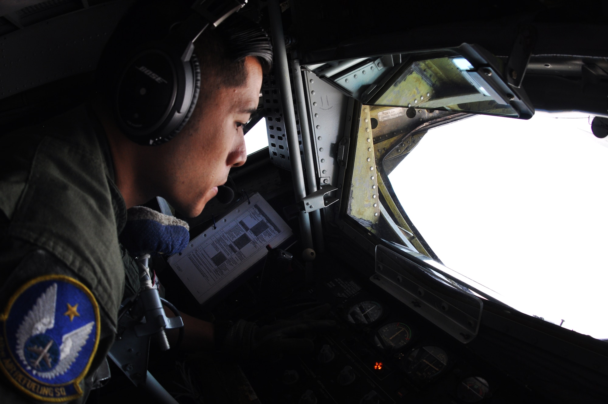 Tech. Sgt. John Bui, 18th Air Refueling Squadron boom operator, prepares to refuel the U.S. Air Force Thunderbirds Air Demonstration Squadron, June 4, 2015.  During the flight, Bui performed fourteen air refueling contacts for the squadron, which was on their way to the Heart of Texas Airshow in Waco, Texas, June 6-7.  (U.S. Air Force photo by Tech. Sgt. Abigail Klein)