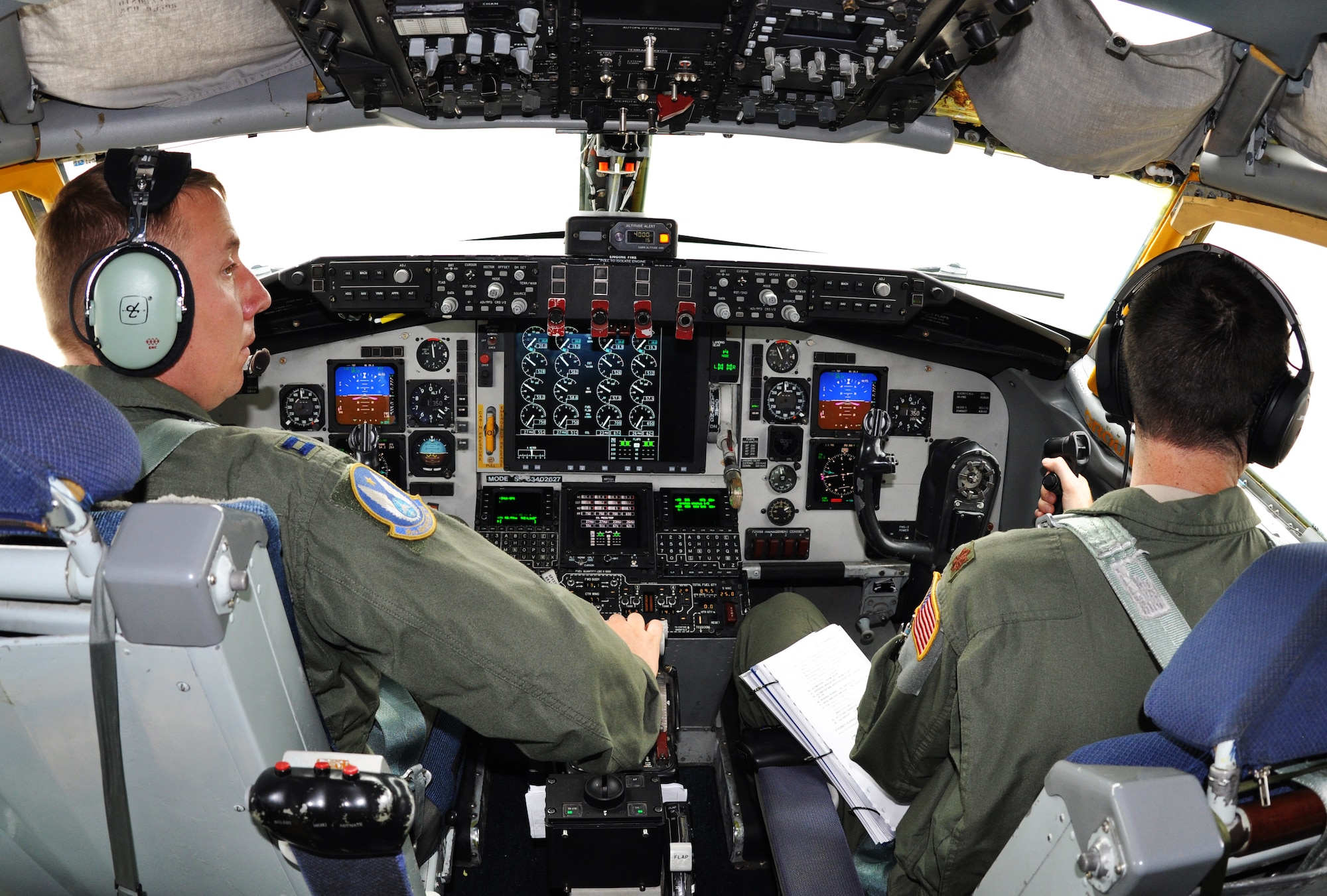 (Left to right) Capt. Brian Doom and Maj. Michael Murphy, 18th Air Refueling Squadron pilots, fly a KC-135 Stratotanker assigned to McConnell Air Force Base, Kan., to provide air refueling support for the Thunderbirds, June 4, 2015. The KC-135 aircrew, all Air Force Reservists from the 931st Air Refueling Group, provided several air refueling missions for the Thunderbirds during the past week.  (U.S. Air Force photo by Tech. Sgt. Abigail Klein)