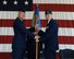 Col. James Boster, 14th Operations Group Commander, hands the guidon for the 37th Flying Training Squadron to Lt. Col. Jason Loe, the new 37th FTS Commander, June 4 at an official change of command ceremony at the Fire Department. The ceremony signifies a formal transfer of authority and responsibility for a unit which ensures the unit is never without official leadership and also signifies an allegiance of Airmen to their new unit's commander. (U.S Air Force Photo/Elizabeth Owens)
