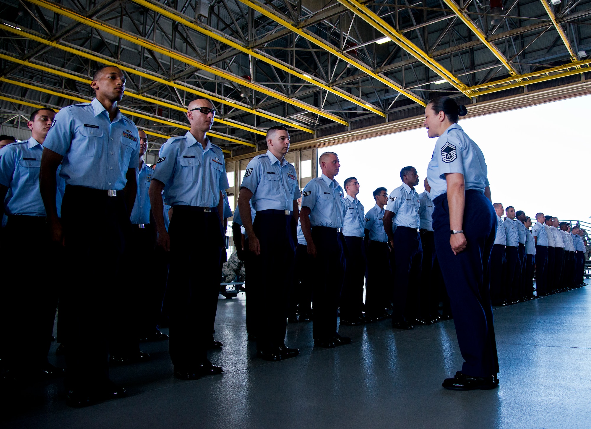 Senior Master Sgt. Magdalena Cortez calls each group of Airmen and civilians to attention prior to the 96th Test Wing change of command ceremony June 4 at Eglin Air Force Base, Fla.  Col. Christopher Azzano took the reins of the wing from Maj. Gen. David Harris, who leaves to take command of the Air Force Test Center.  (U.S. Air Force photo/Samuel King Jr.)