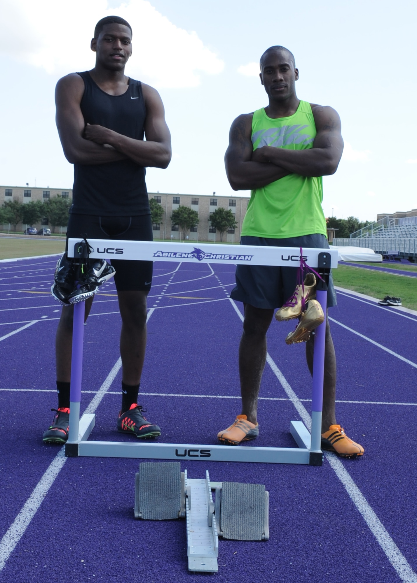 U.S. Air Force Senior Airmen Parnelle Shands, left, 317th Aircraft Maintenance Squadron crew chief, and Kwesi Toney, 7th Logistics Readiness Squadron equipment, train in different track and field events May 18, 2015, at Abilene Christian University in Abilene, Texas. Both Airmen were selected to represent the U.S. Air Forces in Europe at the 2015 Headquarter Air Command Track and Field Championship, May 26-28, 2015, in Amsterdam, Netherlands. (U.S. Air Force photo by Senior Airman Shannon Hall/Released)