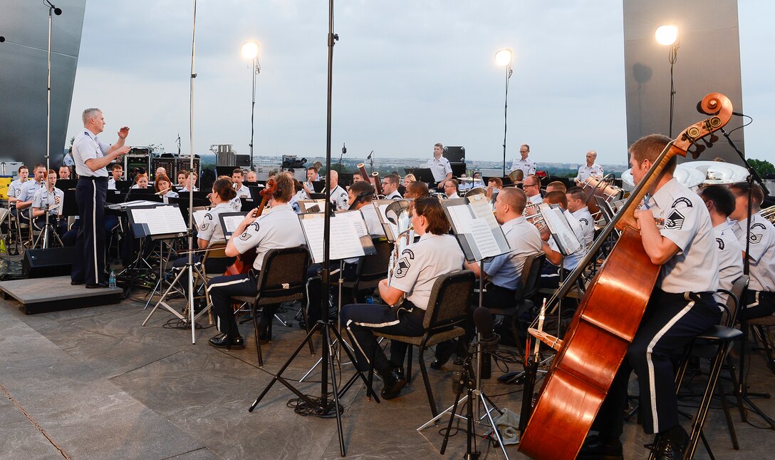 Col. Larry Lang, commander of The United States Air Force Band, conducts the inaugural performance of the 2015 U.S. Air Force Band Summer Concert Series at the Air Force Memorial in Arlington, Va., May 29, 2015. (U.S. Air Force photo/Andy Morataya)