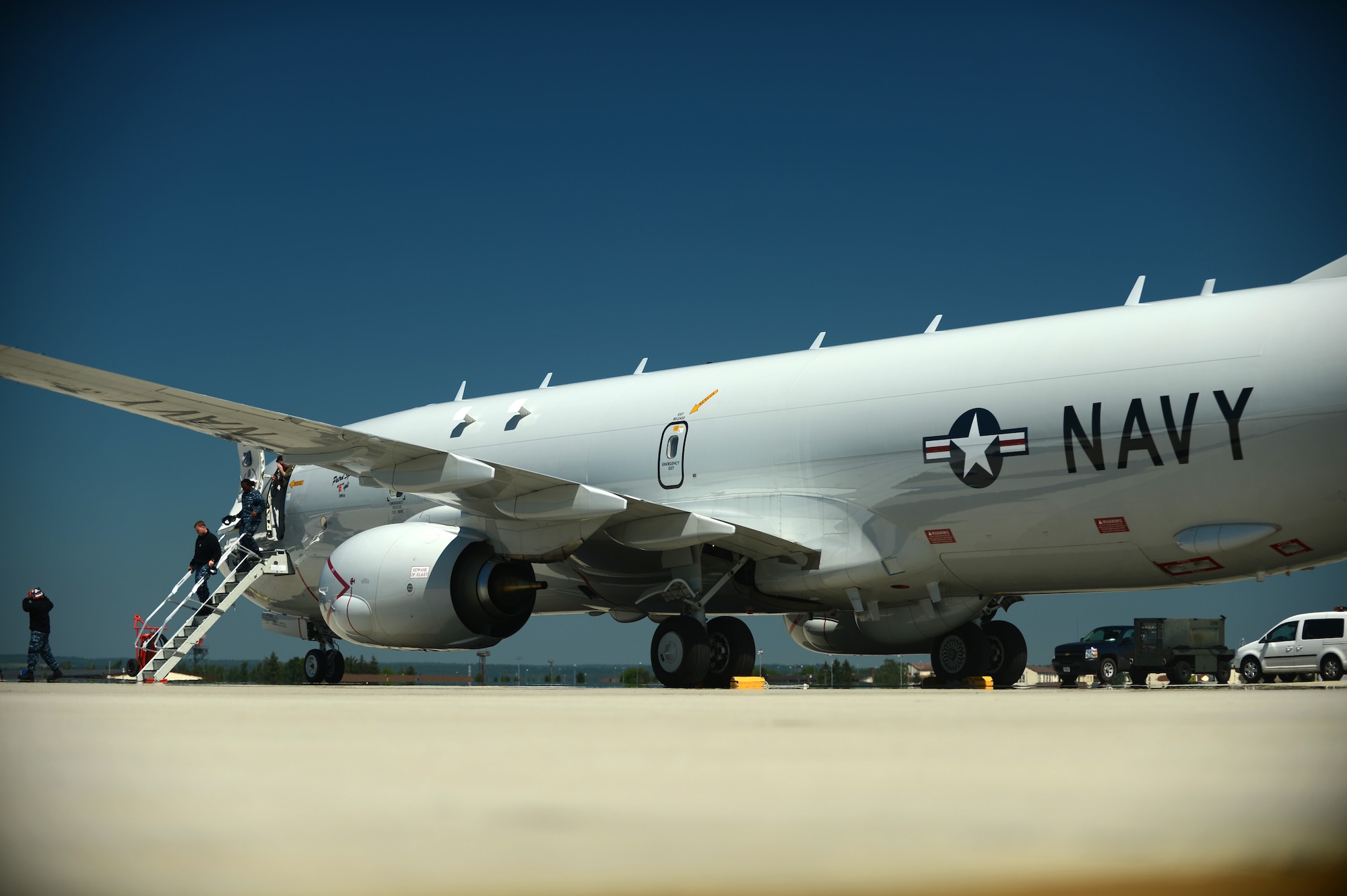 Members of the U.S. Navy de-board a Boeing P-8 Poseidon that arrived on the flightline of Spangdahlem Air Base, Germany, June 5, 2015. The aircraft, which departed from Naval Air Station Jacksonville, Fla., is in Europe to participate in BALTOPS 2015, an annual allied interoperability exercise that will allow ground, maritime and air forces from participating nations to demonstrate air defense, maritime interdiction, anti-subsurface warfare, mine countermeasures, and amphibious operations in a joint environment to ensure regional security. (U.S. Air Force photo by Senior Airman Gustavo Castillo/Released)