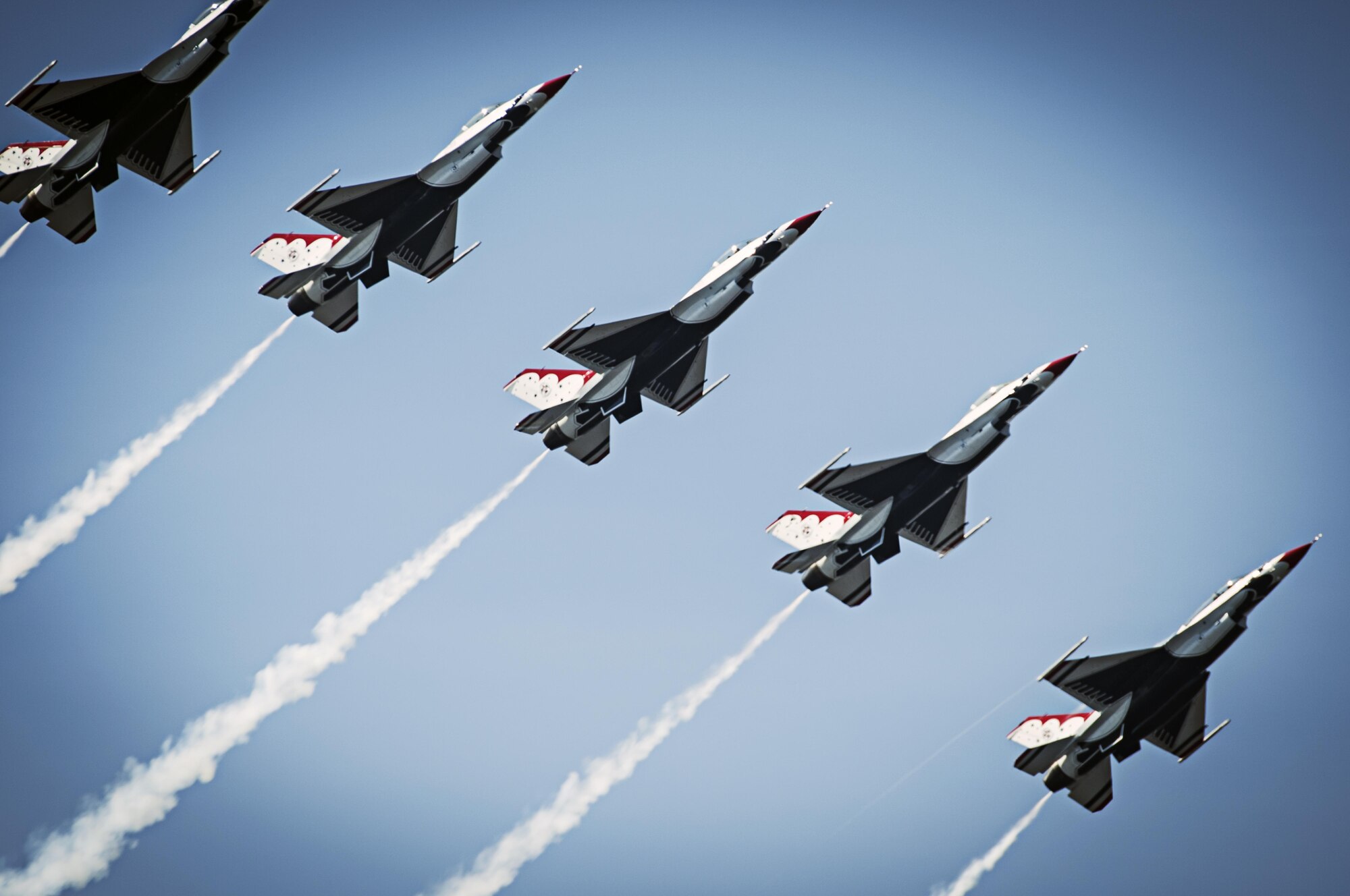 The 2015 Dayton Air Show will highlight numerous aviation acts, including the U.S. Air Force Thunderbirds. In this photo, the Thunderbirds pilots perform the Line Break Loop maneuver during the Thunder on the Bay Air Show at Keesler Air Force Base, Miss., March, 28, 2015. (U.S. Air Force photo/Tech. Sgt. Manuel J. Martinez)