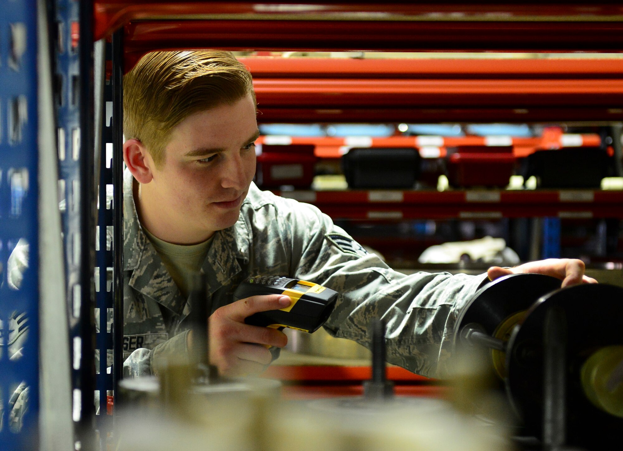 Senior Airman Jacob Keiser, 48th Component Maintenance Squadron aerospace propulsions journeyman, scans equipment at Royal Air Force Lakenheath, England, June 3, 2015. The 48th Communications Squadron recently completed an IETM server upgrade for the 48th CMS computers, saving an average of 165 man hours a month and $198,057.60 annually. (U.S. Air Force photo by Airman 1st Class Dawn M. Weber/Released)