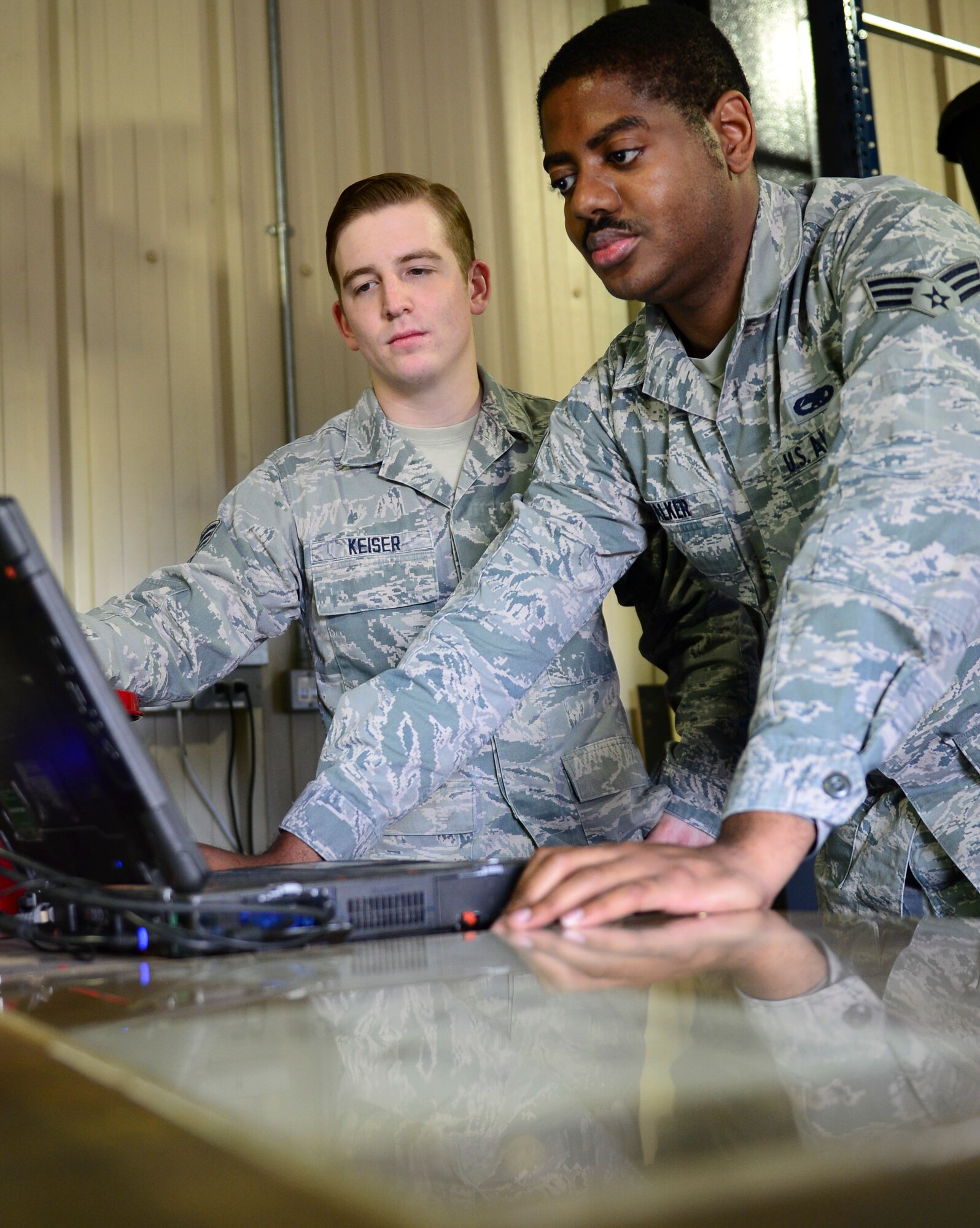 Senior Airmen Jacob Keiser and Geoffrey Walker, 48th Component Maintenance Squadron aerospace propulsions journeymen, log on to the Interactive Electronic Technical Manual server at Royal Air Force Lakenheath, England, June 3, 2015. The 48th Communications Squadron recently completed an IETM server upgrade for the 48th CMS computers. (U.S. Air Force photo by Airman 1st Class Dawn M. Weber/Released)