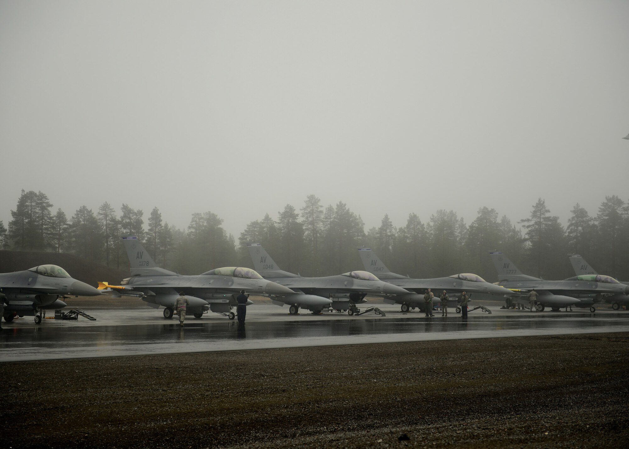 F-16 Fighting Falcon’s with the 510th Fighter Squadron from Aviano Air Base, Italy are parked on an apron at Kallax Air Base, Sweden, May 27, 2015 during Arctic Challenge Exercise 2015. Nine nations participated in the exercise to help ensure interoperability and strengthen relationships with NATO allies and Partners for Peace. (U.S. Air Force photo by Staff Sgt. Evelyn Chavez/Released)