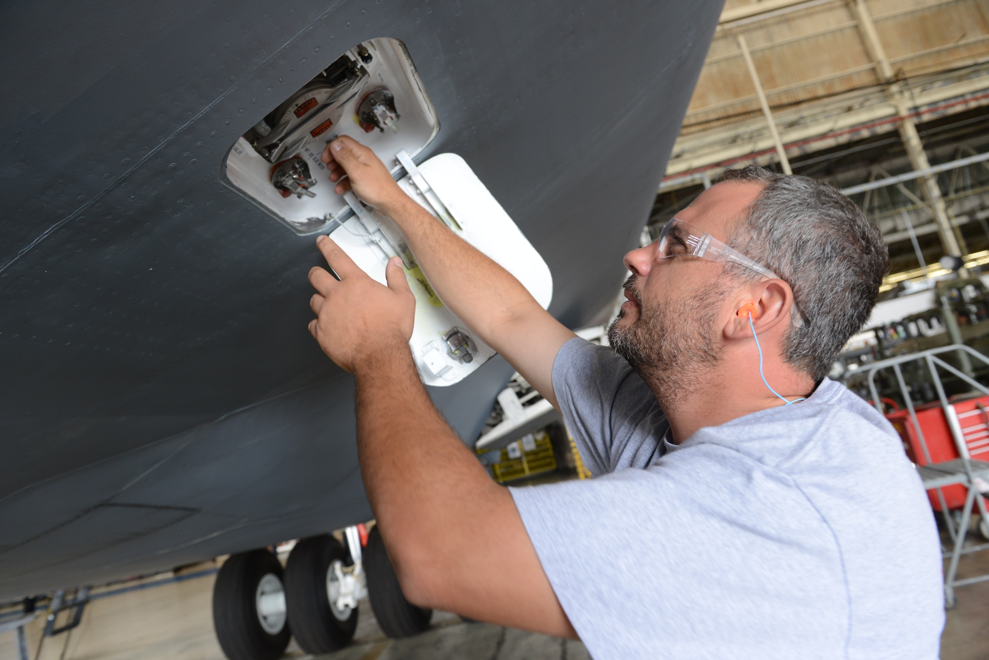 Shawn Coffee, 559th AMXS sheet metal mechanic, performs operations checks on a C-5M service pan, May 27, 2015. This high-demand aircraft arrived at the base unscheduled in need of major repairs, a fitting replacement and first-ever latrine modification. (U.S. Air Force photo by Tommie Horton)