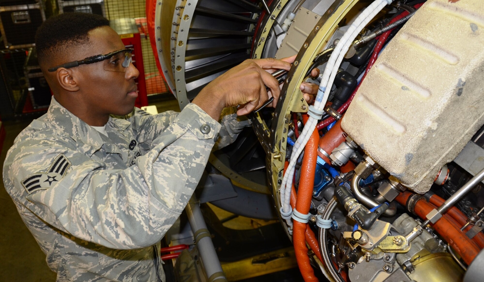 Senior Airman Jordan Traore, 175th Maintenance Squadron, works on an engine for an A-10C Thunderbolt II. Traore is the June spotlight Airman in the Maryland Air National Guard. (U.S. Air National Guard photo by Tech. Sgt. David Speicher/RELEASED)