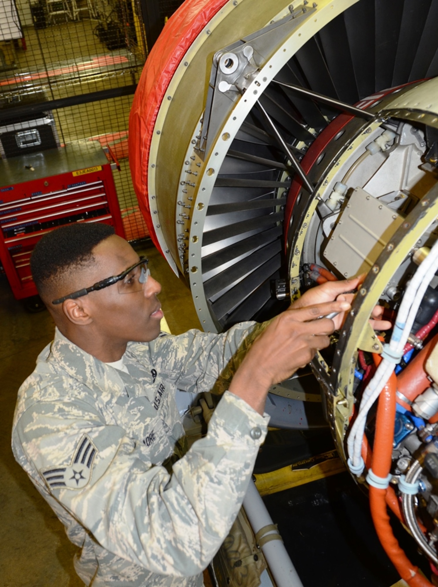 Senior Airman Jordan Traore, 175th Maintenance Squadron, works on an engine for an A-10C Thunderbolt II. Traore is the June spotlight Airman in the Maryland Air National Guard. (U.S. Air National Guard photo by Tech. Sgt. David Speicher/RELEASED)