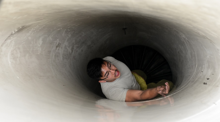 Staff Sgt. Jonicko Dela Cruz, 35th Aircraft Maintenance Unit dedicated crew chief, inspects the intake of an F-16 Fighting Falcon during Exercise Buddy Wing 15-4 at Kunsan Air Base, Republic of Korea, June 3, 2015. In an effort to enhance U.S. and ROKAF combat capability, Buddy Wing exercises are conducted multiple times throughout the year on the peninsula to sharpen interoperability between the allied forces so that if need be, they are always ready to fight as a combined force. (U.S. Air Force photo by Staff Sgt. Nick Wilson/Released)