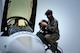A Republic of Korea Air Force KF-16 Fighting Falcon pilot from the 123rd Tactical Fighter Squadron, 20th Fighter Wing, Seosan Air Base, prepares to climb out of his assigned aircraft with assistance from a crew chief from the 20th FW, after arriving at Kunsan Air Base, ROK, for Exercise Buddy Wing 15-4, June 1, 2015. In an effort to enhance interoperability, Buddy Wing exercises allow pilots an opportunity to exchange ideas and practice combined tactics in order to fight and fly as one Allied force. (U.S. Air Force photo by Staff Sgt. Nick Wilson/Released)