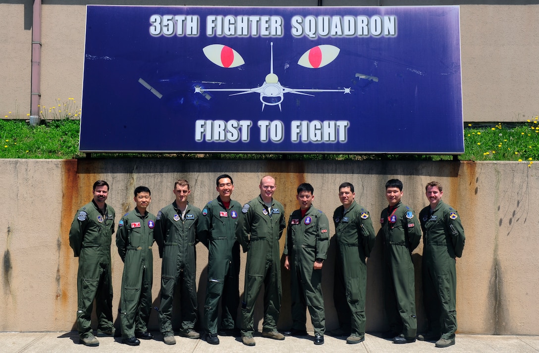 Republic of Korea Air Force pilots from the 123rd Tactical Fighter Squadron, Seosan Air Base, attend a preflight briefing at Kunsan Air Base, ROK, for Exercise Buddy Wing 15-4, June 4, 2015. During the five-day exercise, the 20th FW pilots, maintenance and support personnel are integrating with Wolf Pack Airmen on all aspects of the exercise to include mission planning, briefing, execution and debriefing. (U.S. Air Force photo by Staff Sgt. Nick Wilson/Released)