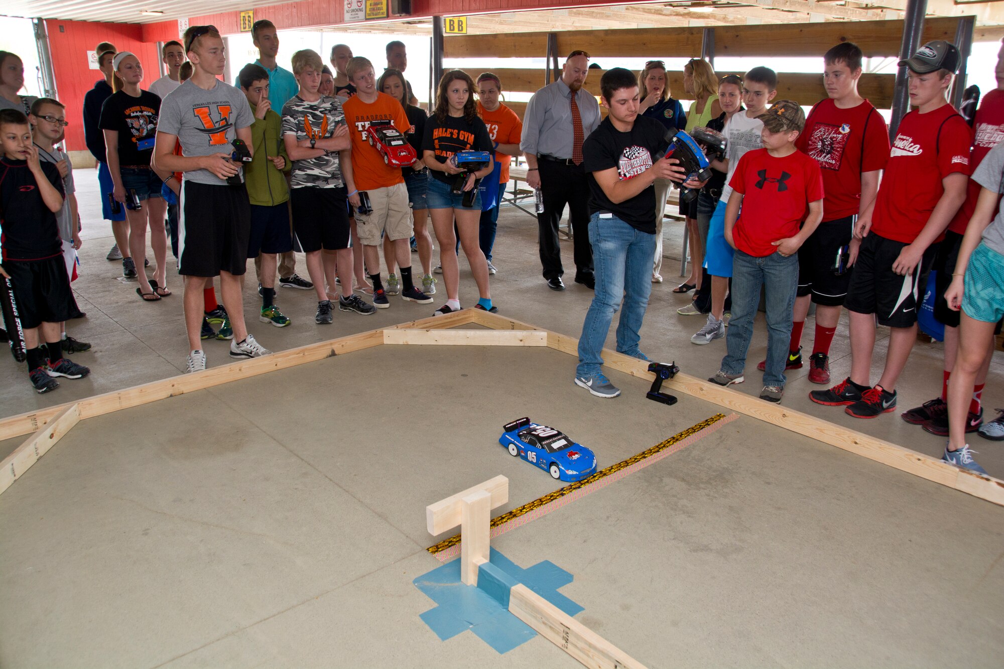 Students from local school districts (Ansonia, Arcanum-Butler, Bradford, New Bremen, St. Henry, Tri-County North, Tri-Village and Versailles) test their RC car modifications in a course race at Eldora Speedway on May 6, 2015.  The course race is part of the 3rd Annual Full Throttle STEM event sponsored by the 711 Human Performance Wing. (U.S. Air Force photo by Rick Eldridge / Released)