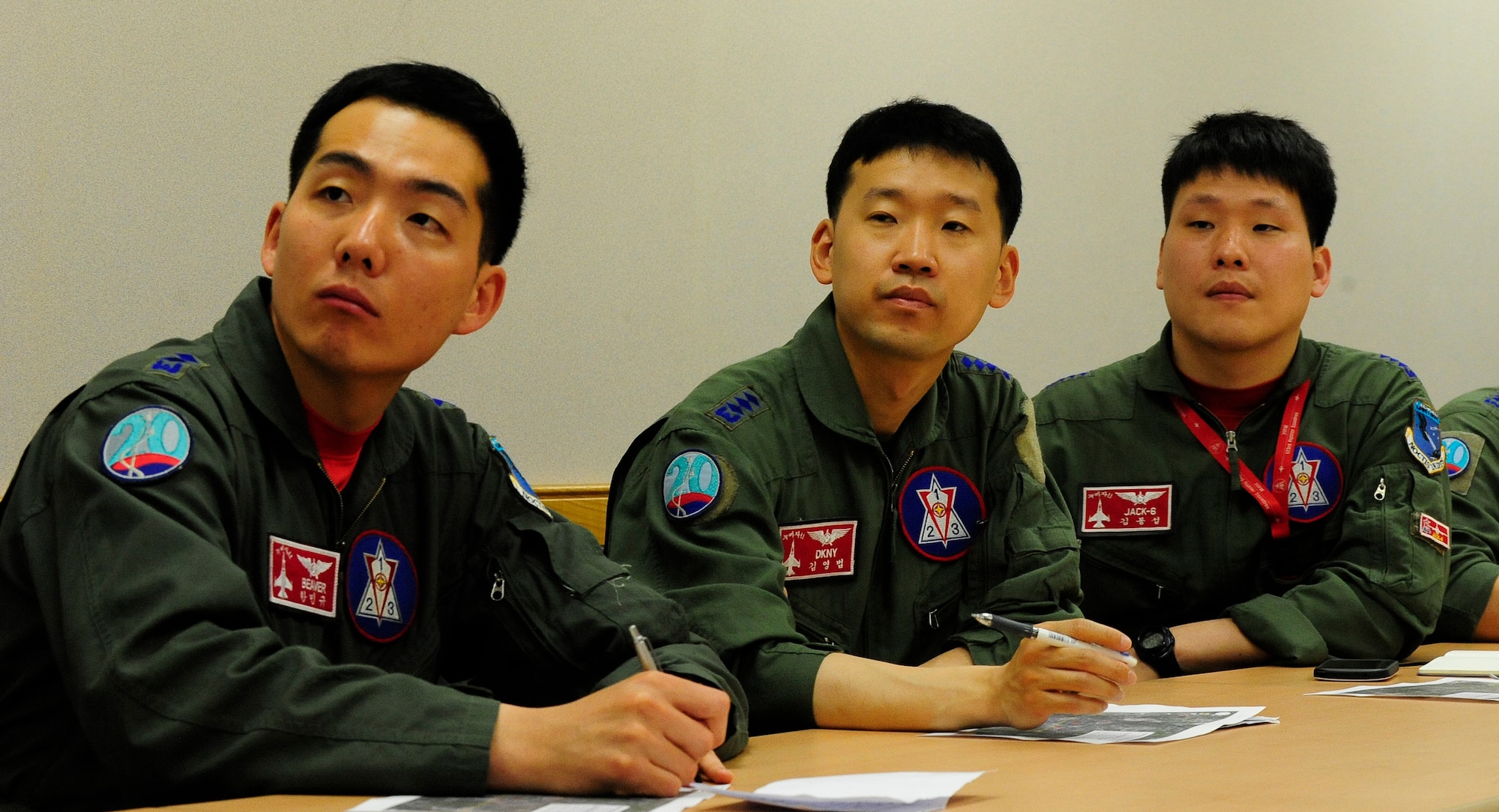 Republic of Korea Air Force pilots from the 123rd Tactical Fighter Squadron, Seosan Air Base, attend a preflight briefing at Kunsan Air Base, ROK, for Exercise Buddy Wing 15-4, June 4, 2015. During the five-day exercise, the 20th FW pilots, maintenance and support personnel are integrating with Wolf Pack Airmen on all aspects of the exercise to include mission planning, briefing, execution and debriefing. (U.S. Air Force photo by Staff Sgt. Nick Wilson/Released)